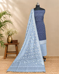 Navy blue silk cotton chudi set with silver accents, traditional Indian jewelry, and matching accessories.
