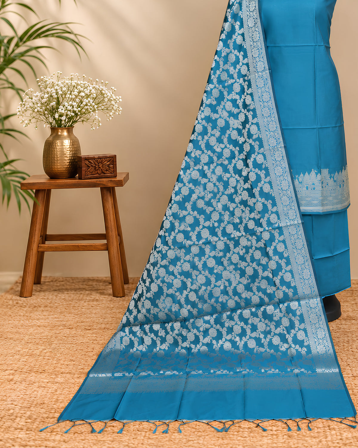 Peacock blue silk cotton Banarasi dupatta with intricate gold zari work, displayed flat to showcase its rich fabric and traditional design.