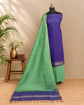 Semi Tussar Checks fabric in purple and green by S Fabs, showcasing a woven material with a checkered pattern.
