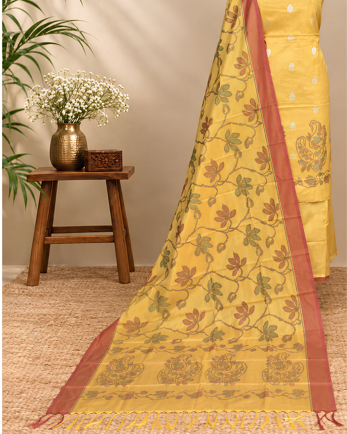 Golden yellow silk Tani print fabric by S Fabs, showcasing smooth, shiny silk material with intricate Tani design details.