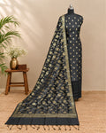 Jet black silk butti fabric from S Fabs, showcasing smooth, luxurious black silk material on a clean surface.