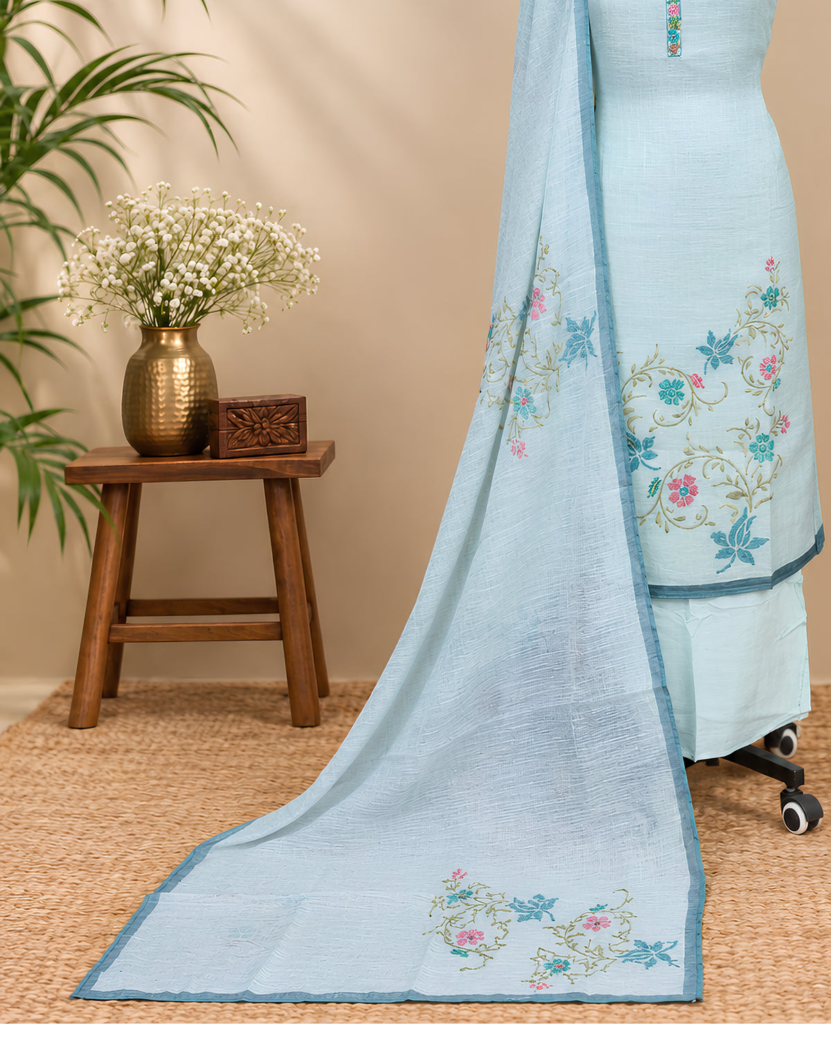 Powder blue linen embroidery chudi showcasing intricate thread work and traditional design from S Fabs.