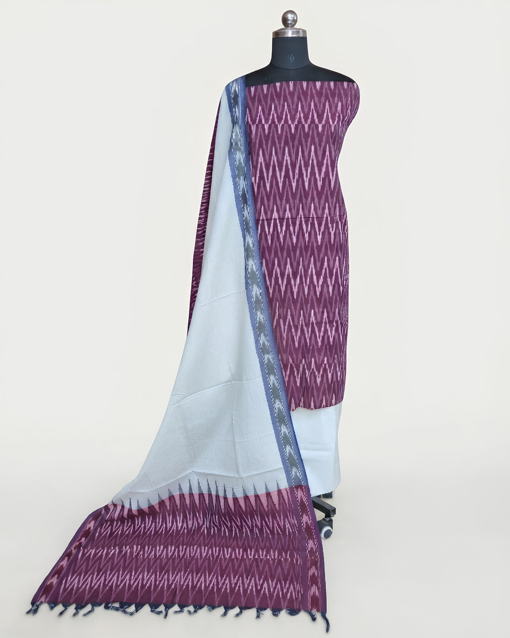 Deep purple Ikkat chudi set with solid white material from S Fabs, showcasing traditional textile design and craftsmanship.