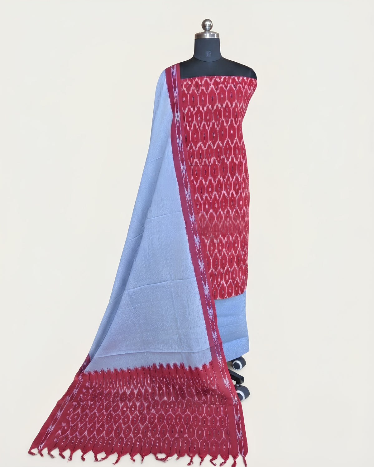 Red and light blue Ikkat Chudi set from S Fabs, featuring vibrant traditional fabric with intricate patterns and rich textures.