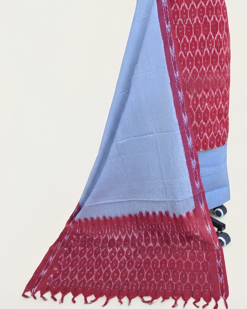 Red and light blue Ikkat chudi set fabric by S Fabs, showcasing vibrant traditional material with intricate patterns.