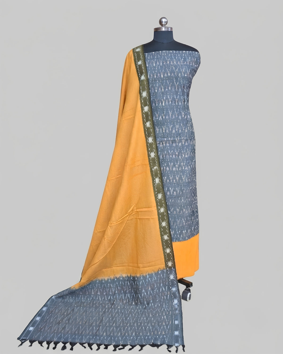 Slate grey and mustard yellow Ikkat chudi set by S Fabs, showcasing traditional woven fabric with intricate patterns.