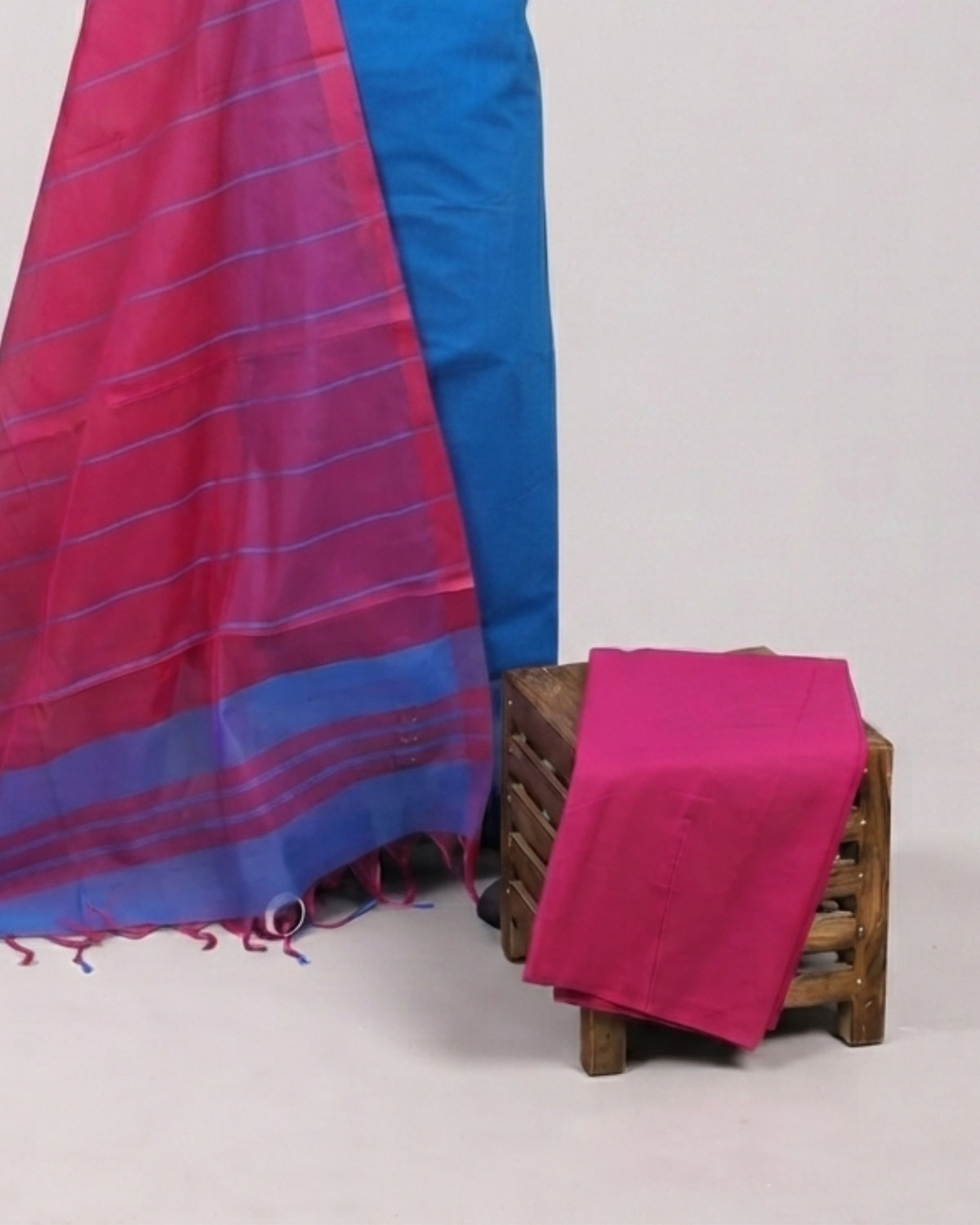 Cotton fabric with electric blue and magenta stripes from S Fabs Magalagiri collection, showcasing vibrant textile material.