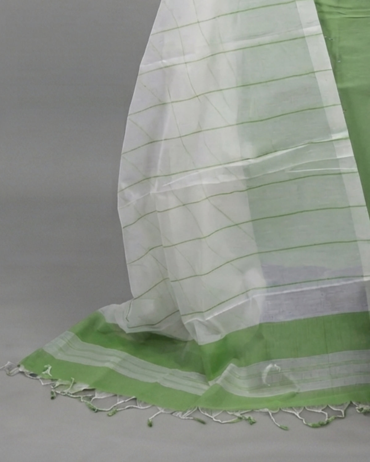Cotton fabric with green and white leaf stripe pattern from S Fabs Magalagiri collection.