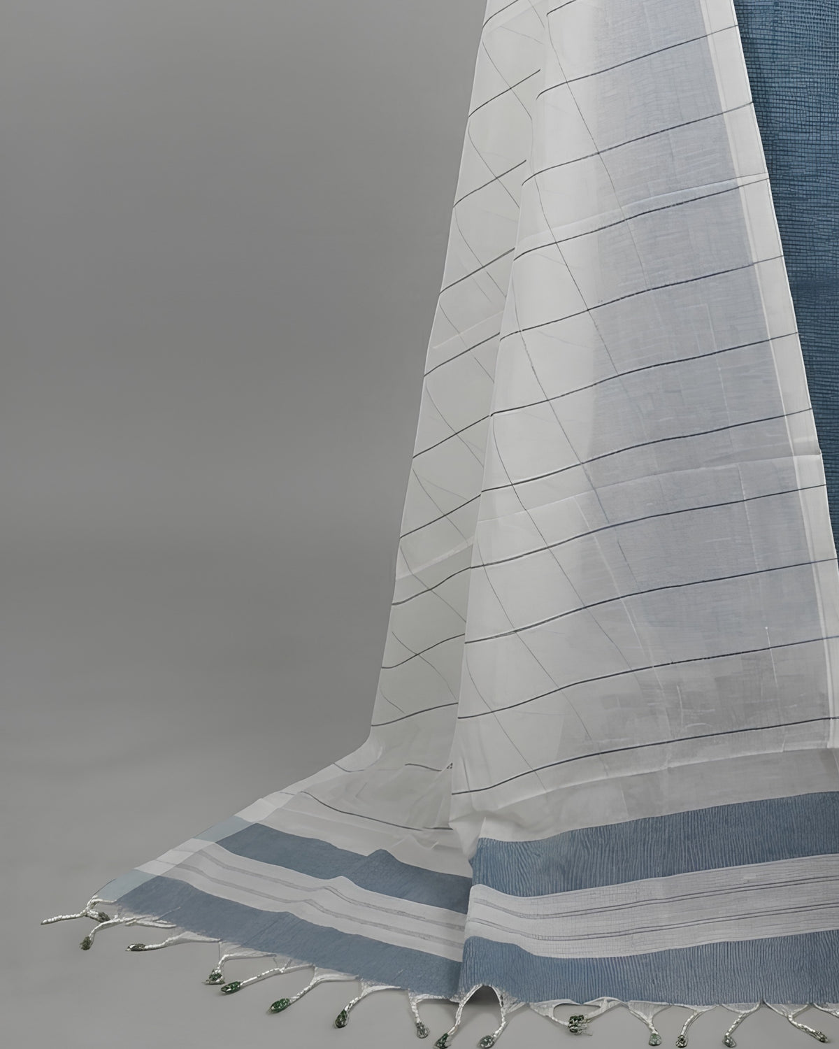 Mangalagiri cotton fabric in slate blue and white, produced by S Fabs, showcasing a soft, traditional textile material.