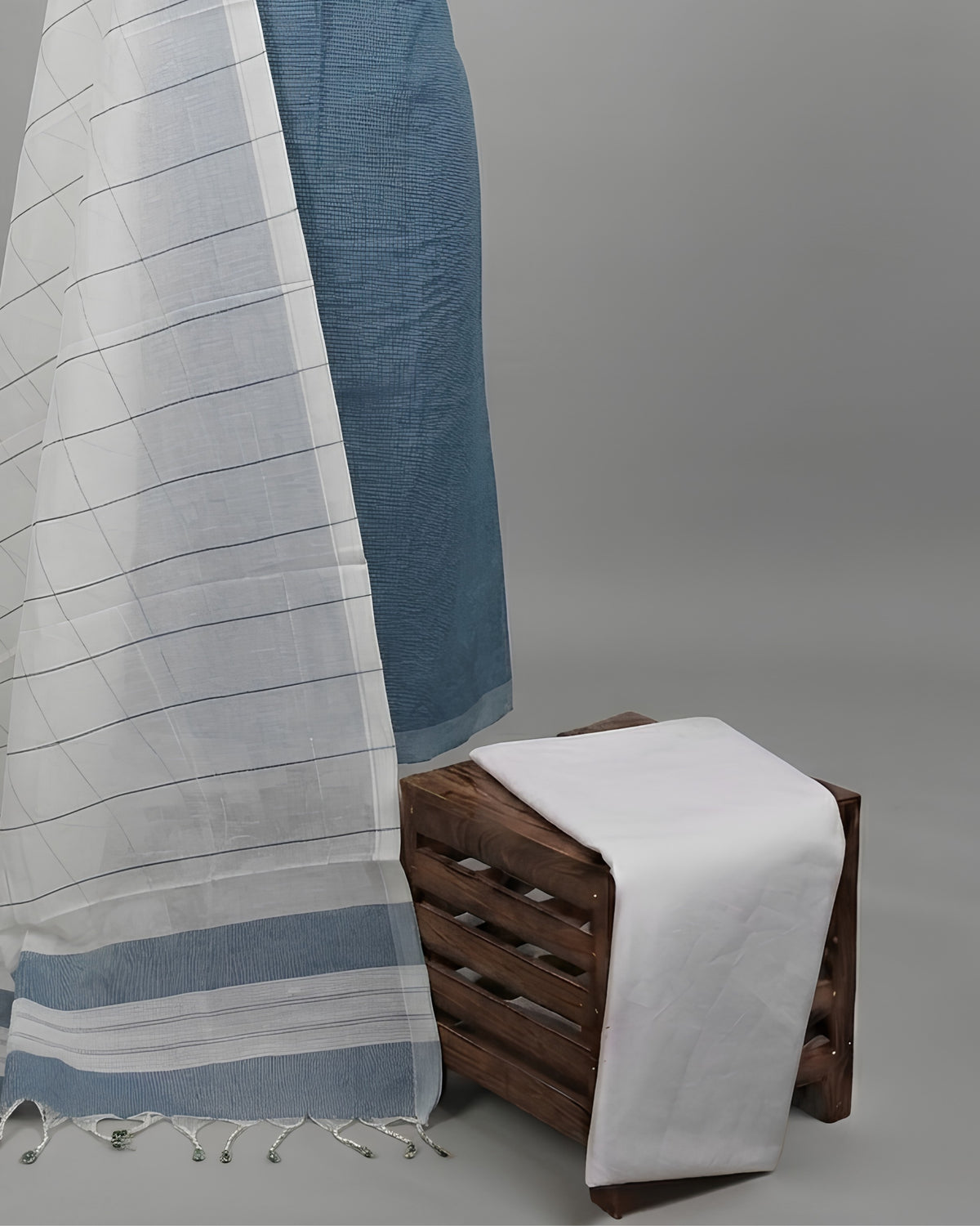 Mangalagiri cotton fabric in slate blue and white from S Fabs, showing the soft, woven material with a subtle pattern.