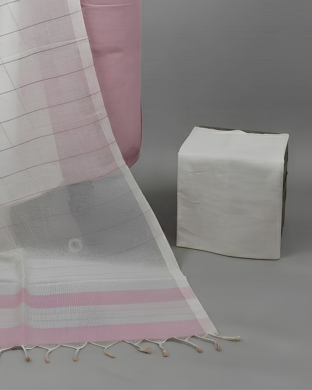 Light pink and white striped Mangalagiri cotton fabric by S Fabs, showcasing its soft, breathable textile pattern.