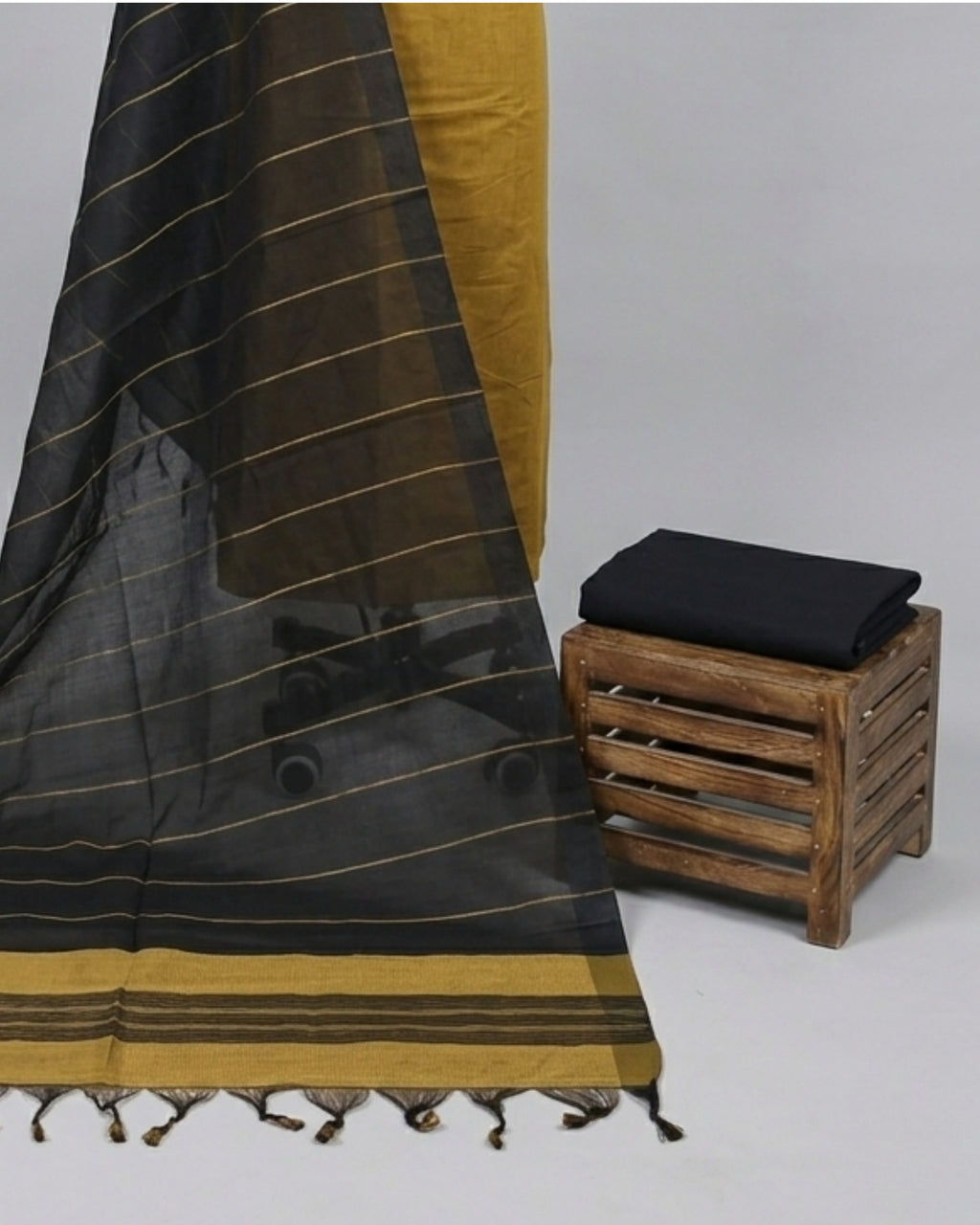 Mangalagiri cotton fabric with mustard yellow and black stripes, produced by S Fabs, showcasing its woven texture.