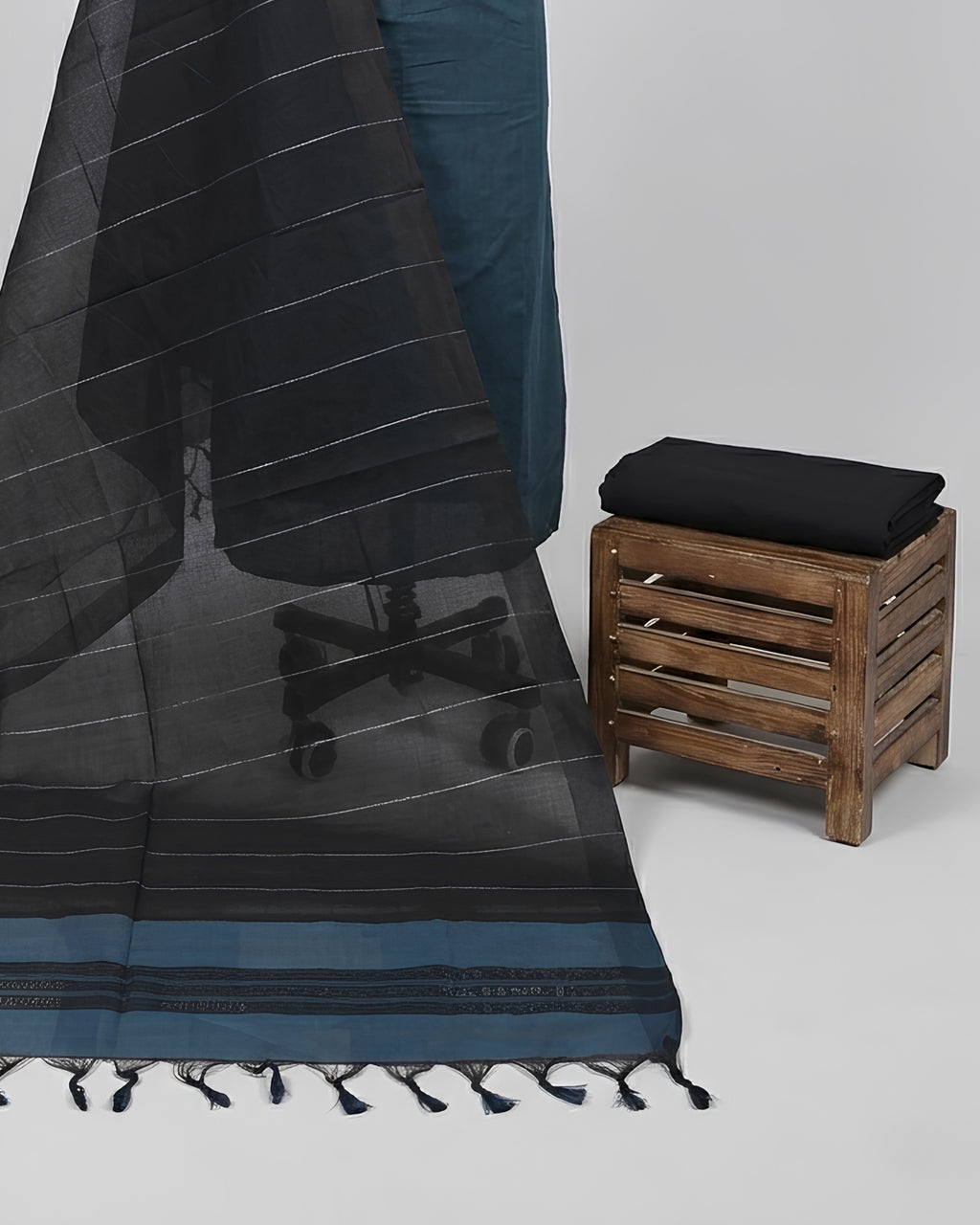 Mangalagiri cotton fabric with teal blue and black stripes from S Fabs, showing the textured material and stripe pattern.