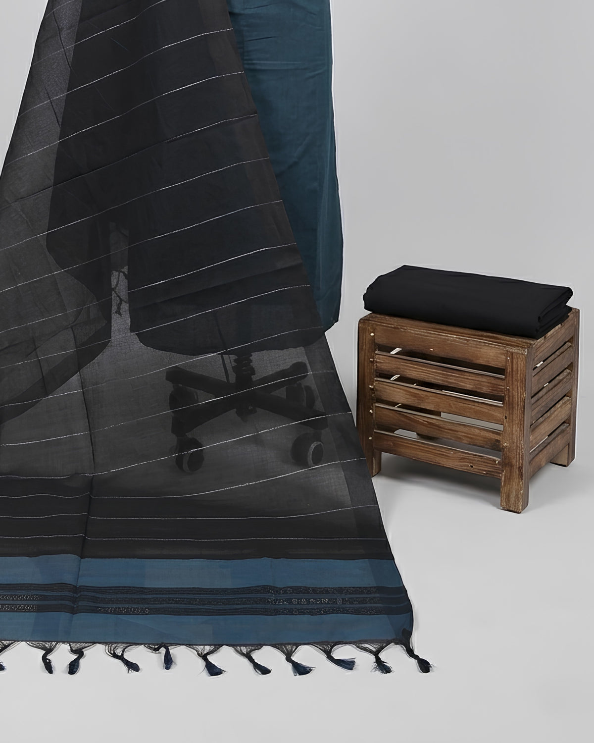 Mangalagiri cotton fabric with teal blue and black stripes from S Fabs, showing the textured material and stripe pattern.