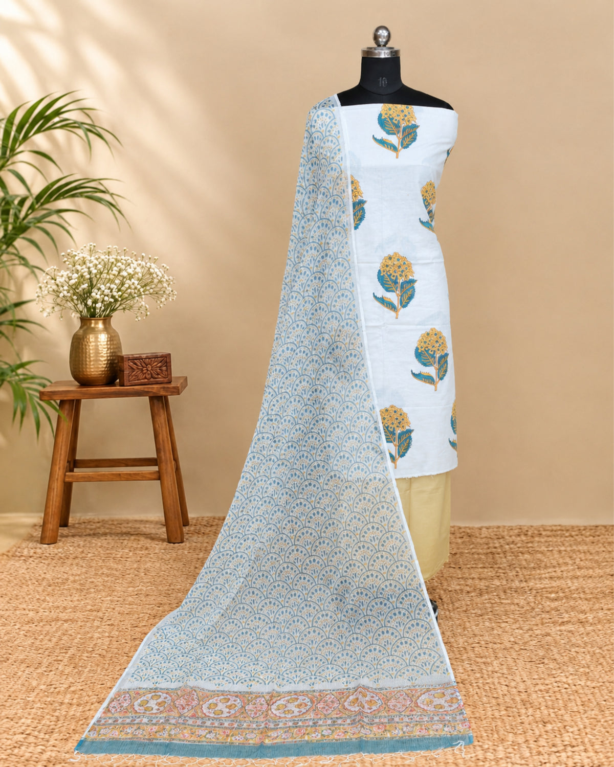 White Mul Mul Kota dupatta with mustard yellow floral pattern, soft fabric from S Fabs.