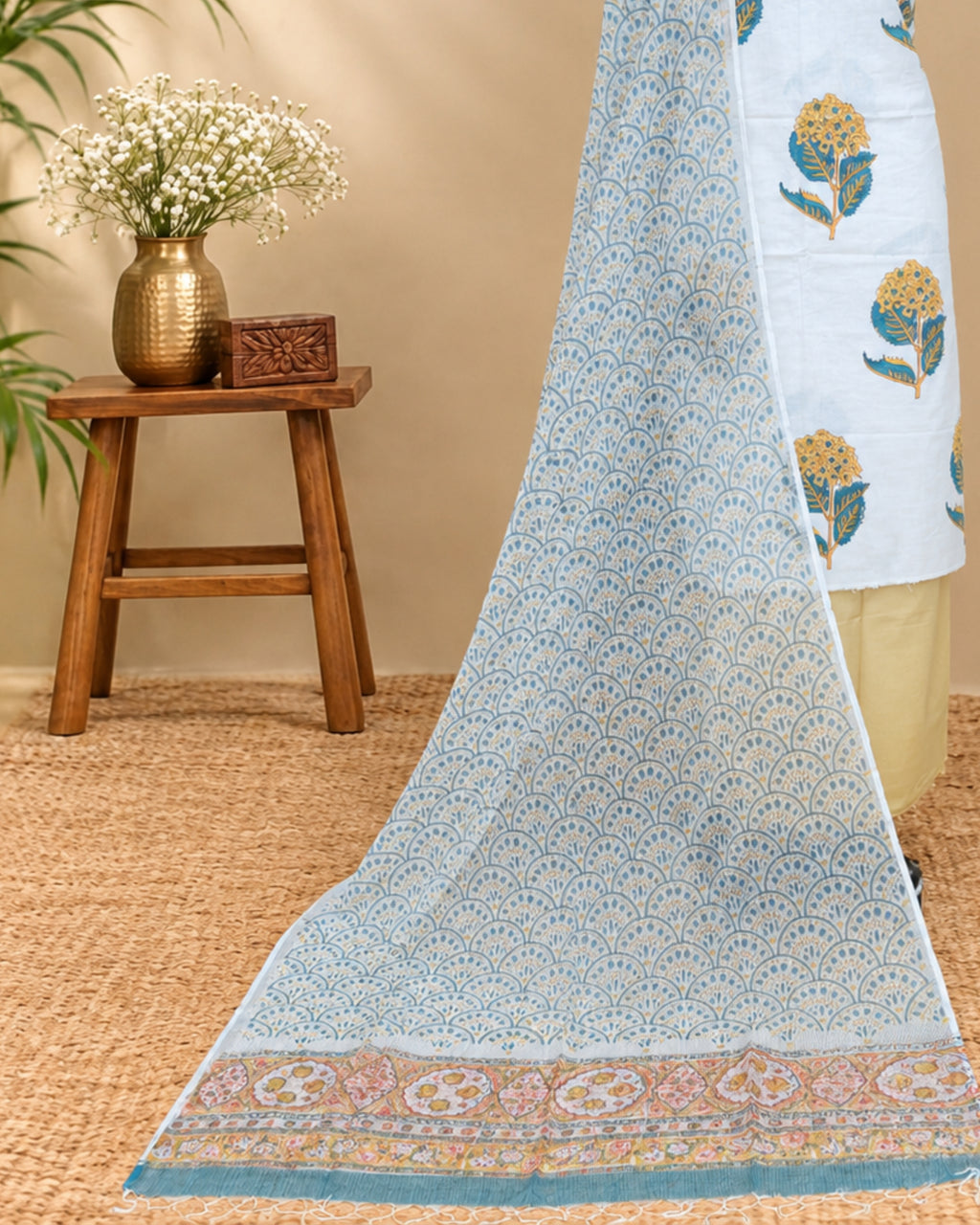 White Mul Mul Kota dupatta with mustard yellow floral pattern, crafted from soft material by S Fabs.