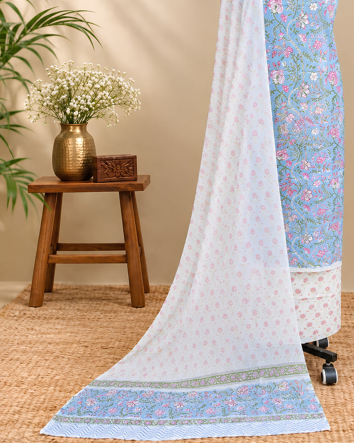 Light blue Mul Mul chiffon dupatta with pink floral pattern from S Fabs, showcasing delicate fabric and elegant design.
