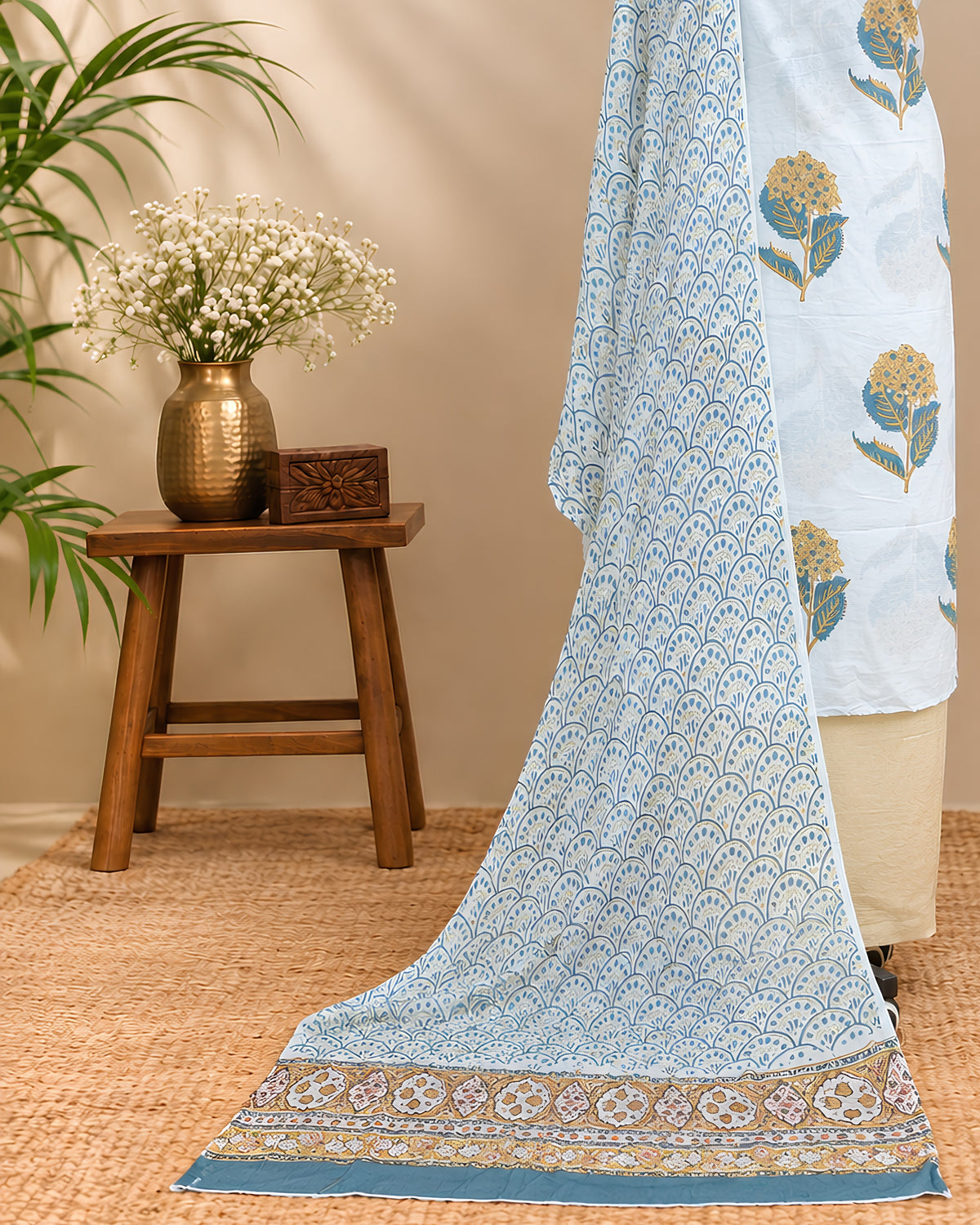 White Mul Mul chiffon dupatta with mustard yellow floral patterns, lightweight material from S Fabs.