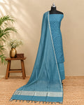 Peacock blue premium silk butti fabric by S Fabs, showcasing smooth, shiny silk material with intricate weave details.