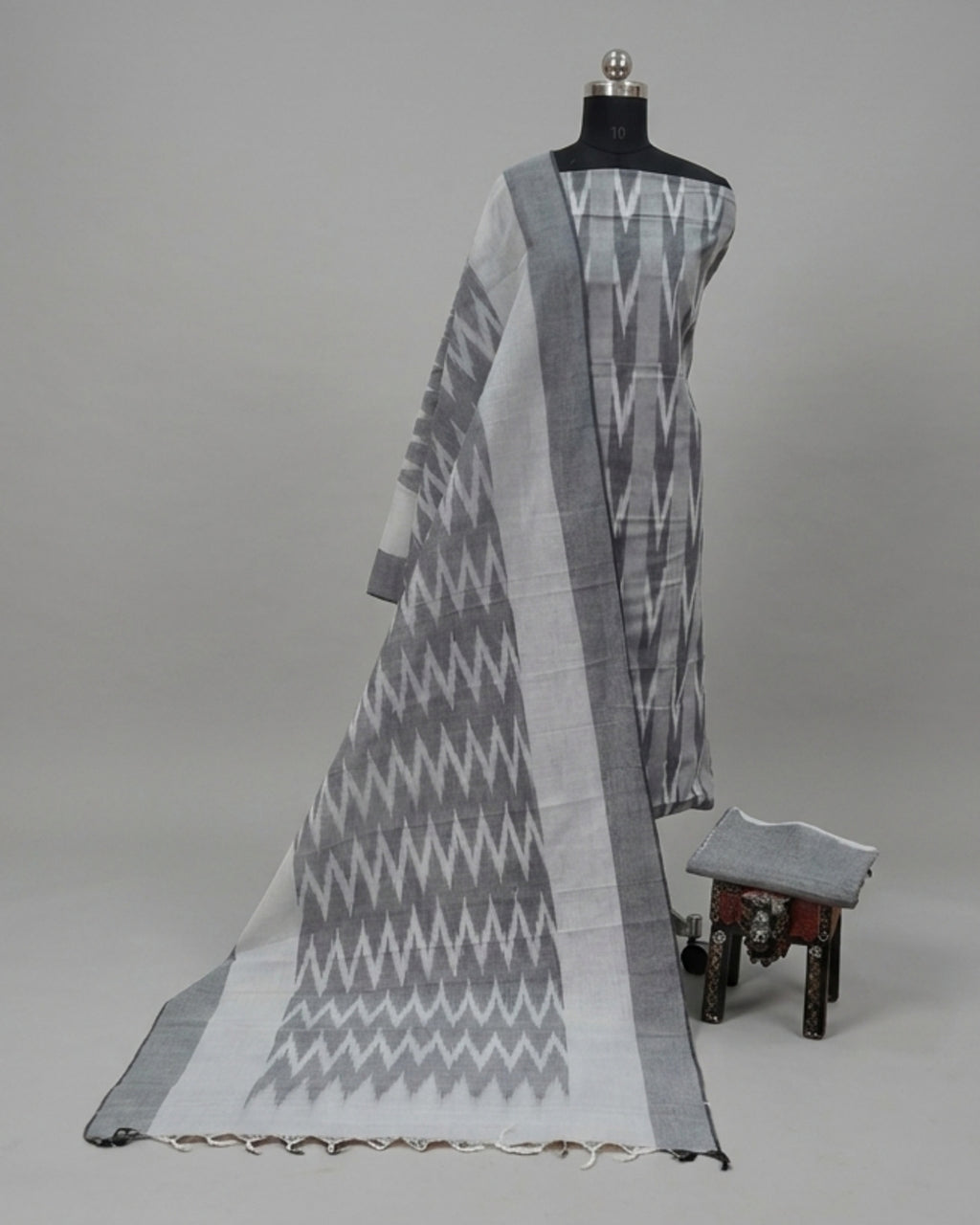 Steel gray PUR Ikkat chudi set made of fabric by S Fabs, shown in a detailed close-up of the material and design.
