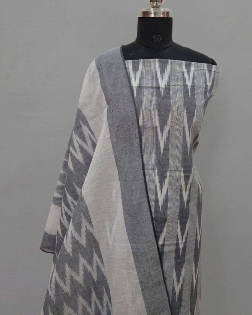 Steel gray PUR Ikkat Chudi set by S Fabs, showcasing traditional fabric with intricate Ikkat pattern and silver bangles.