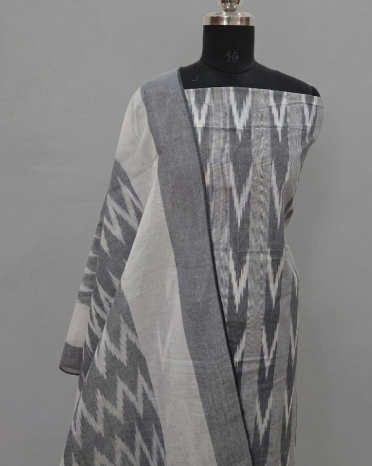 Steel gray PUR Ikkat Chudi set by S Fabs, showcasing traditional fabric with intricate Ikkat pattern and silver bangles.