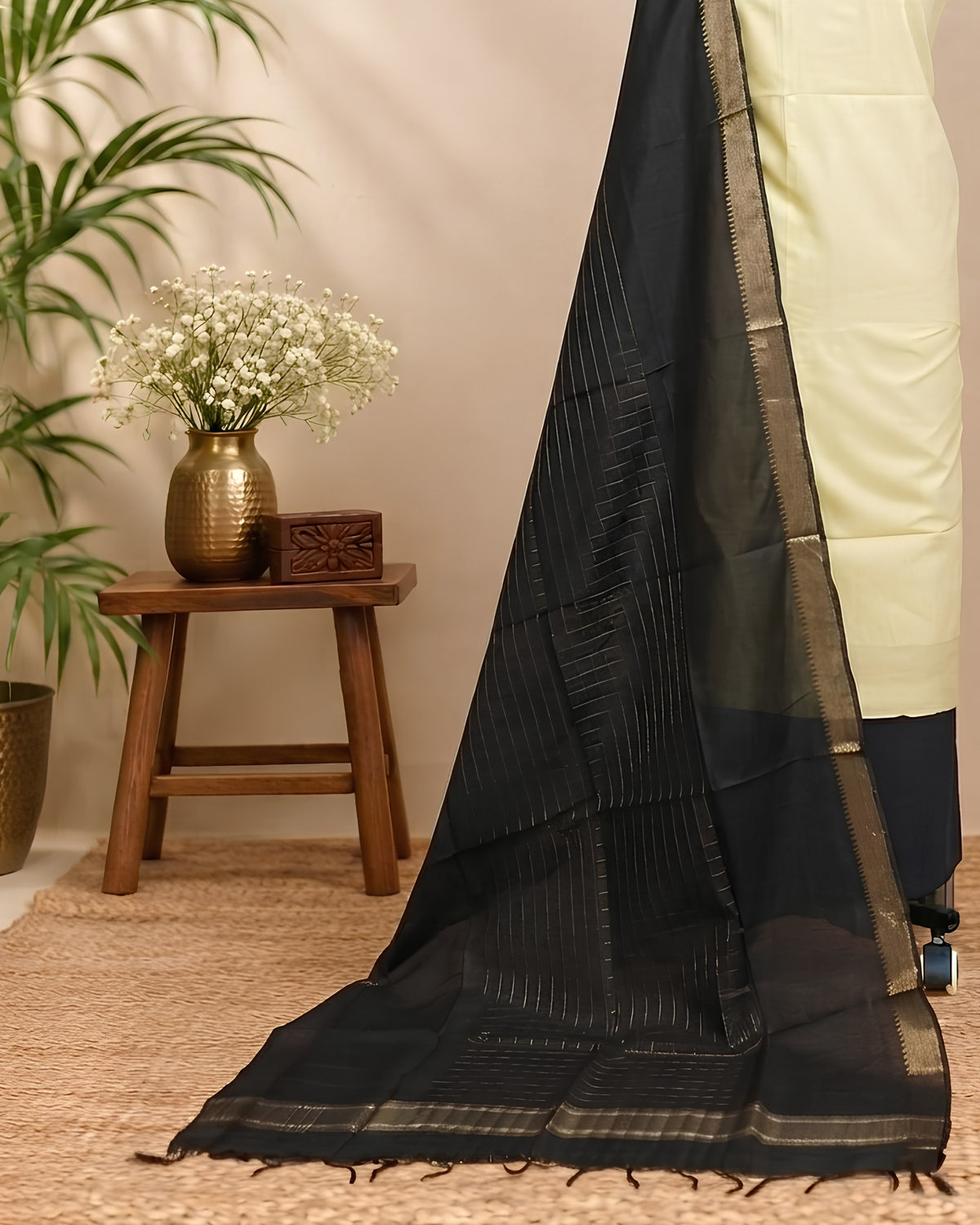 Semi Tussar plain fabric from S Fabs in pale yellow and black, showcasing smooth, lightweight silk material.
