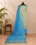 Semi Tussar plain fabric in pale yellow and bright blue by S Fabs, showing smooth, woven textile with vibrant color contrast.