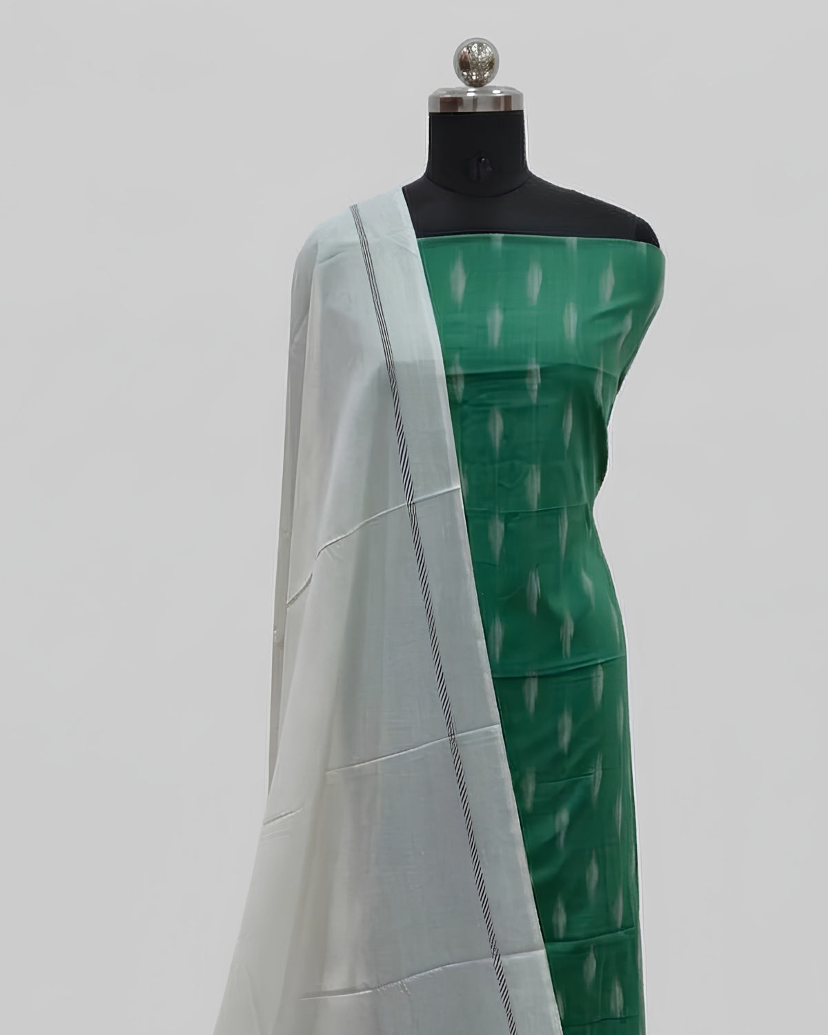 Leaf green and ivory single Ikkat chudi set from S Fabs, showcasing intricate woven fabric and traditional design.