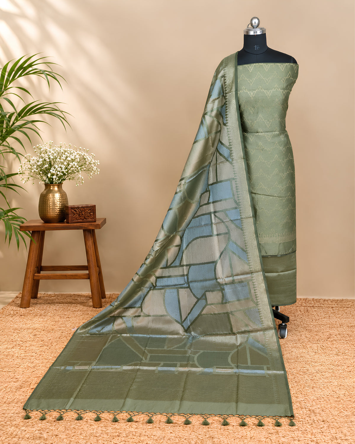 Olive green Tussar zari Jacquard fabric with geometric pattern from S Fabs, showcasing intricate woven design and rich texture.