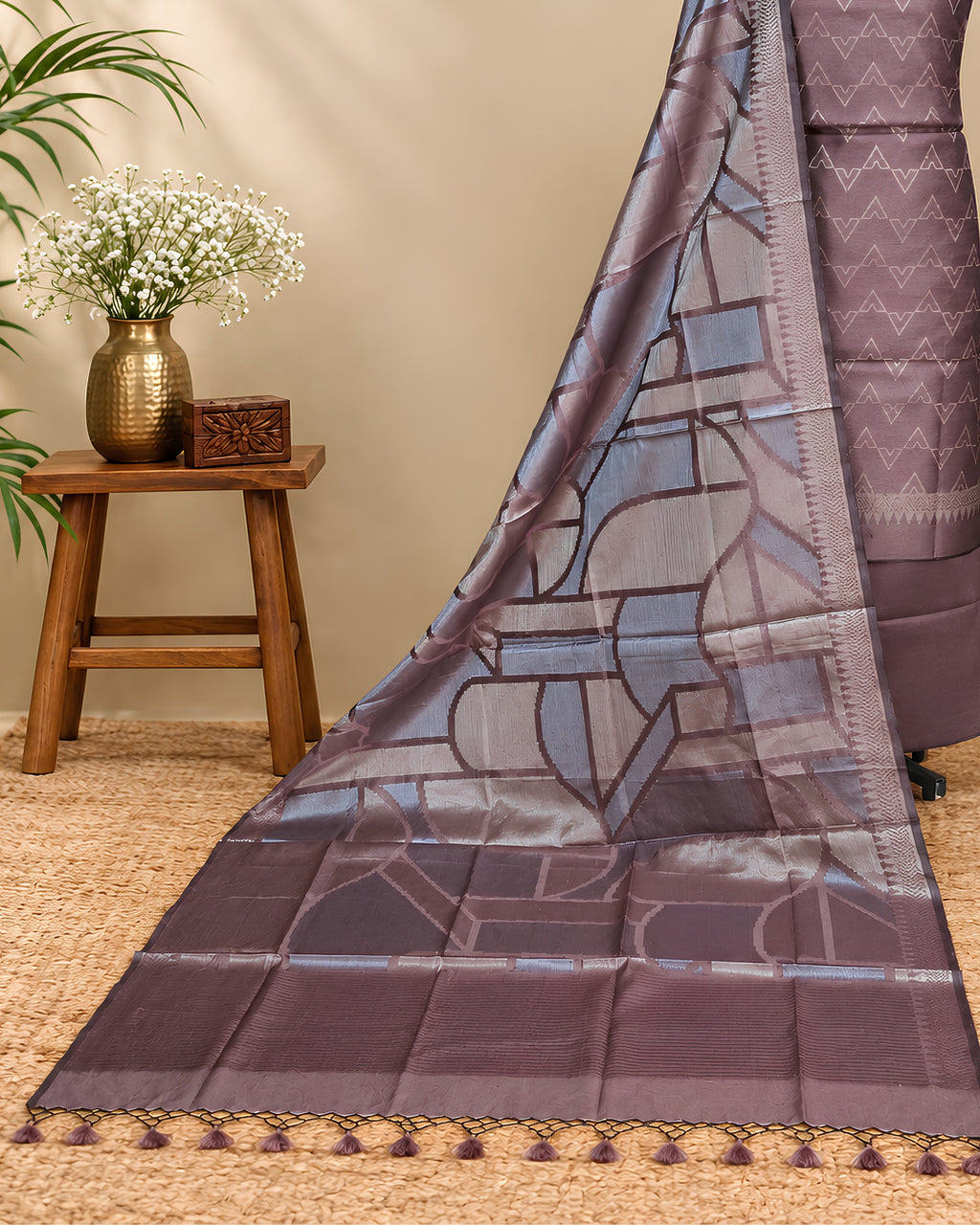 Rich mauve Tussar zari Jacquard fabric with geometric pattern by S Fabs, showcasing intricate woven texture and shimmer.