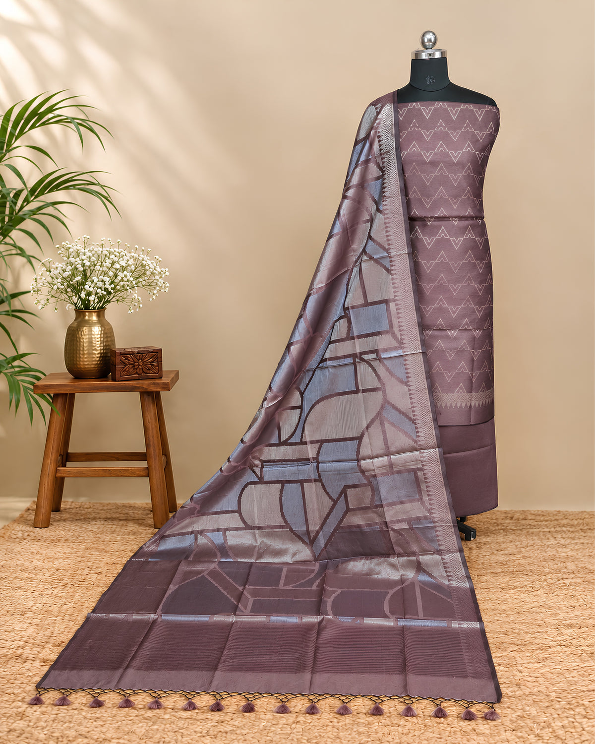 Rich mauve Tussar zari Jacquard fabric with geometric pattern from S Fabs, showcasing intricate woven design and luxurious texture.