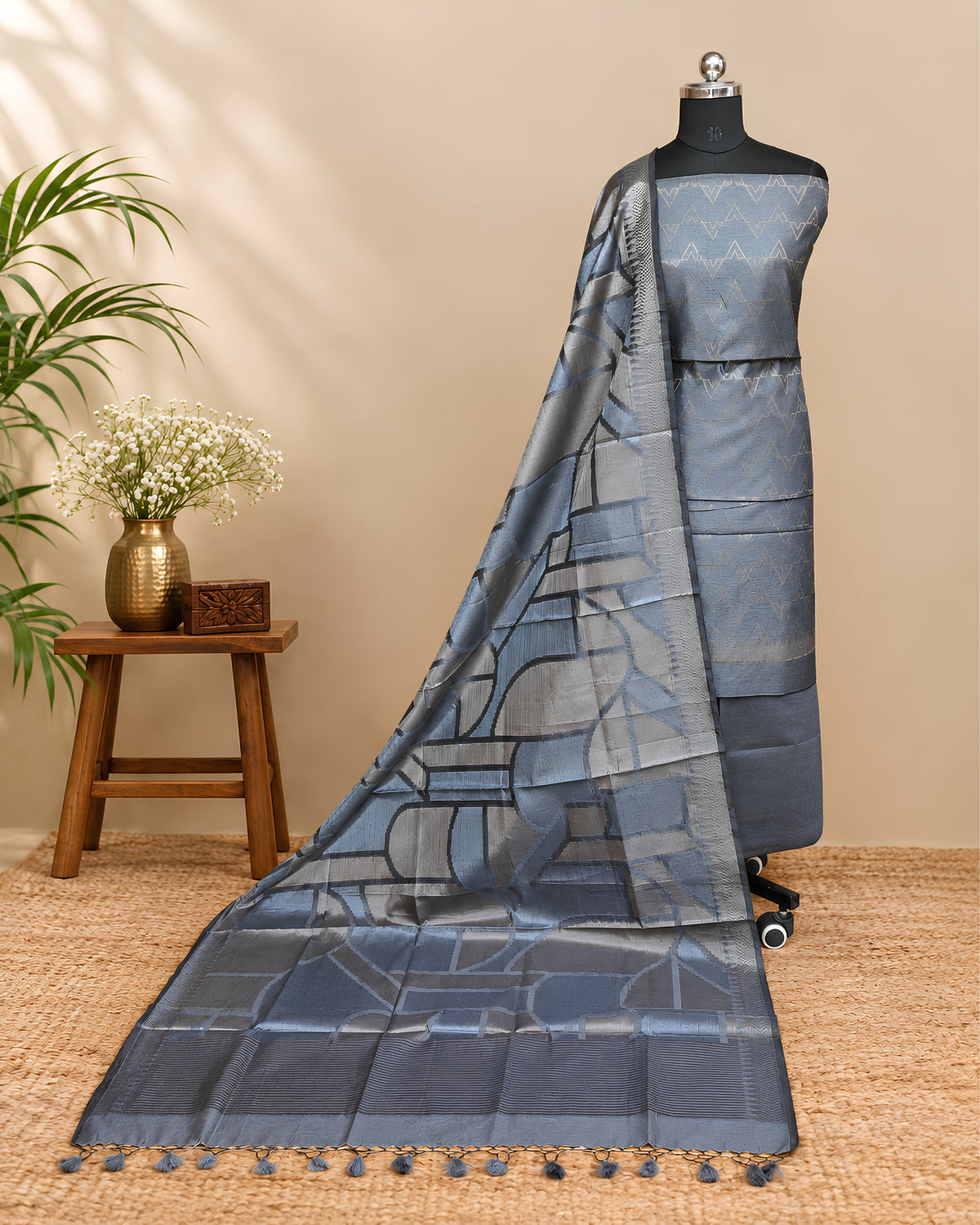 Steel grey Tussar zari Jacquard fabric with geometric pattern from S Fabs, showcasing intricate weaving and luxurious texture.