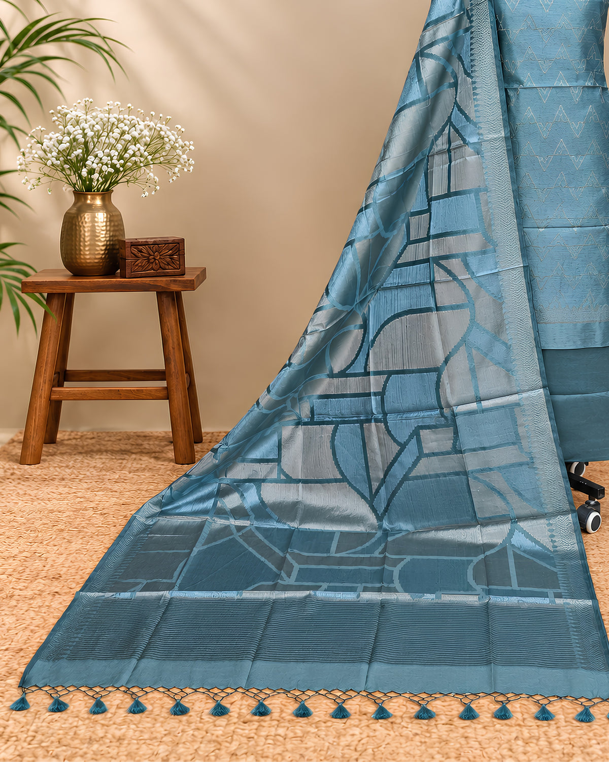 Teal blue Tussar zari Jacquard fabric with geometric pattern from S Fabs, showcasing intricate woven design.