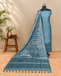 Teal blue Tussar zari Jacquard fabric with geometric pattern from S Fabs, showcasing intricate weaving and rich texture.