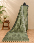 Olive green Tussar zari Jacquard fabric with pine tree pattern by S Fabs, showing detailed woven design.