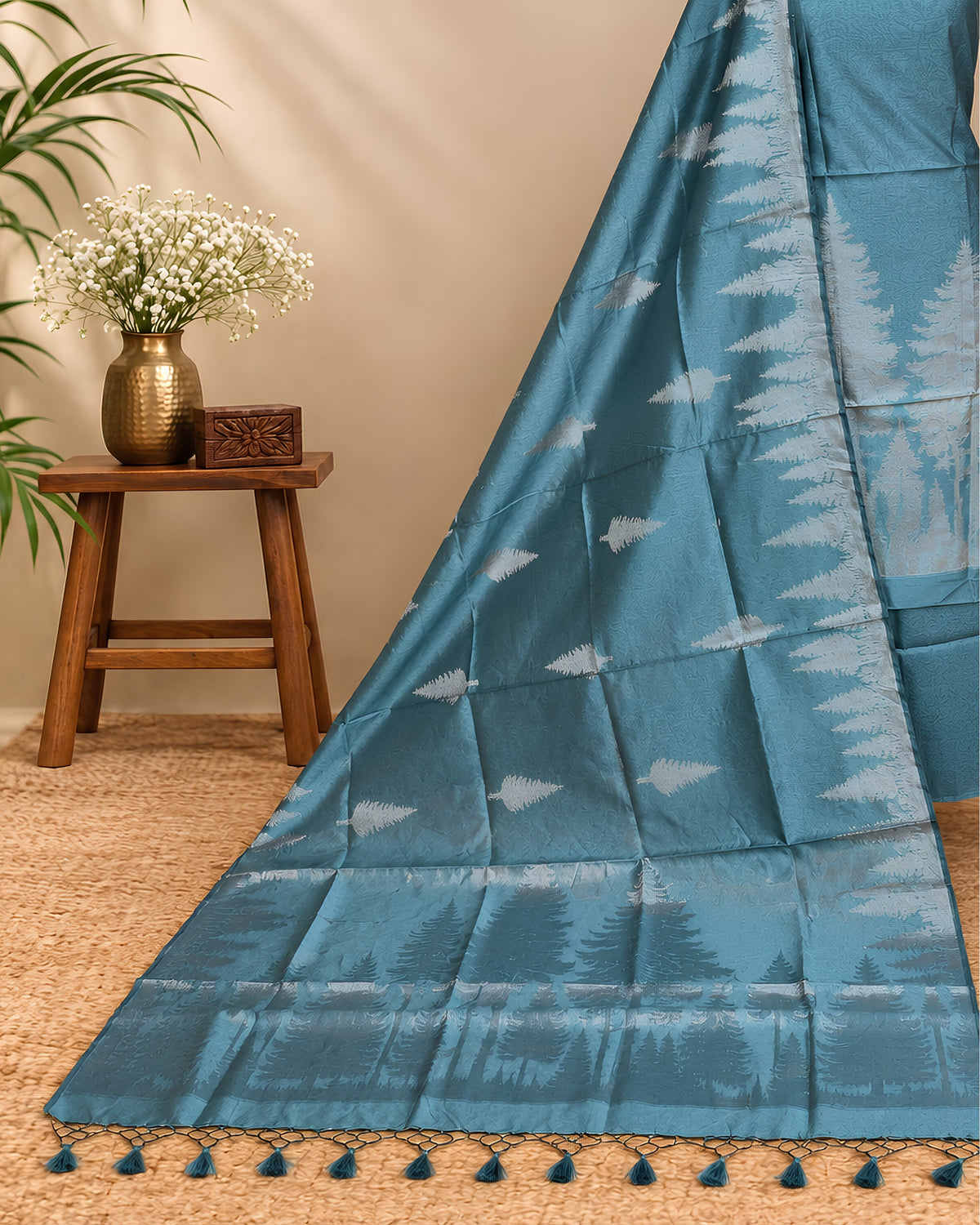 Teal blue Tussar zari Jacquard fabric with pine tree pattern from S Fabs, showcasing intricate woven design.